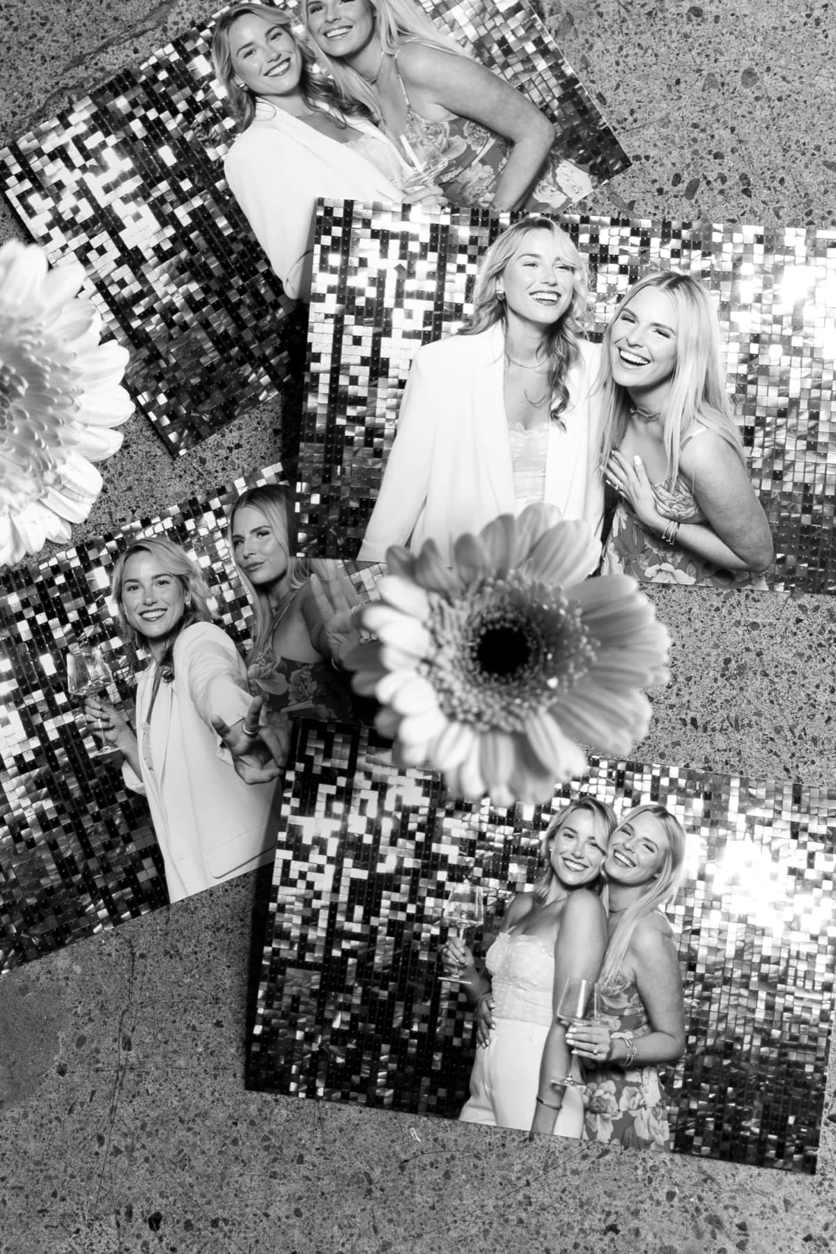 Guests mid-laugh in the glow of the MEMORI photo booth.